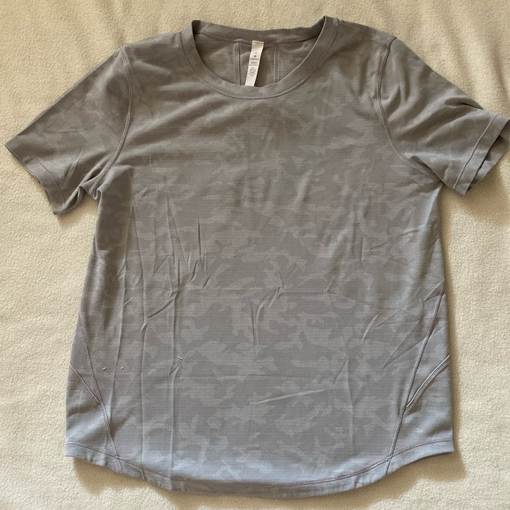 Lululemon top. Size 8. Grey camo. Good condition.